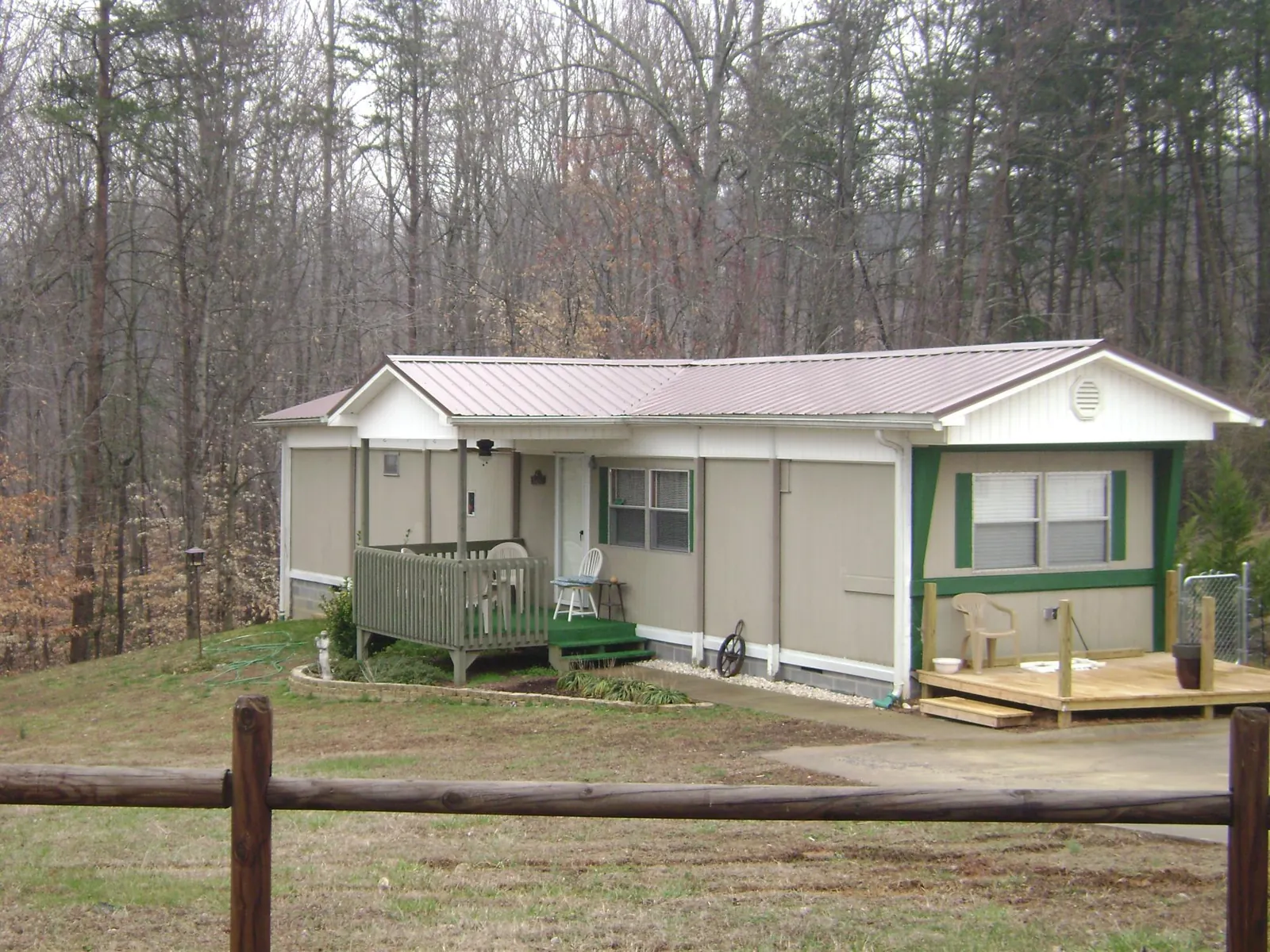 Mauve metal roof on a manufactured home with a new front deck in Trenton